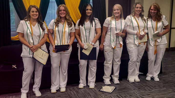 This is a photograph of the graduates from the Accelerated Nursing Program. They include Stacey Edwards, Nellie Hudson, Laura Miranda, Alexis Preston, Sherrie Shevchuck, and Alicia Sturgill.