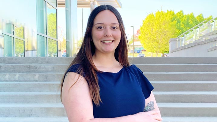 This is an image of Breahna Riess standing on the steps of the Engineering and Math Building on the North East Campus of Cecil College.