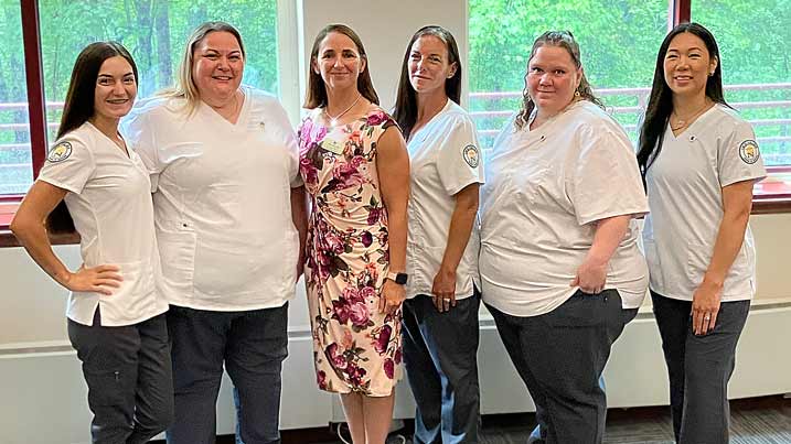 This is an image of the five students who graduated from the LPN program along with Associate Professor Amy Smyth.